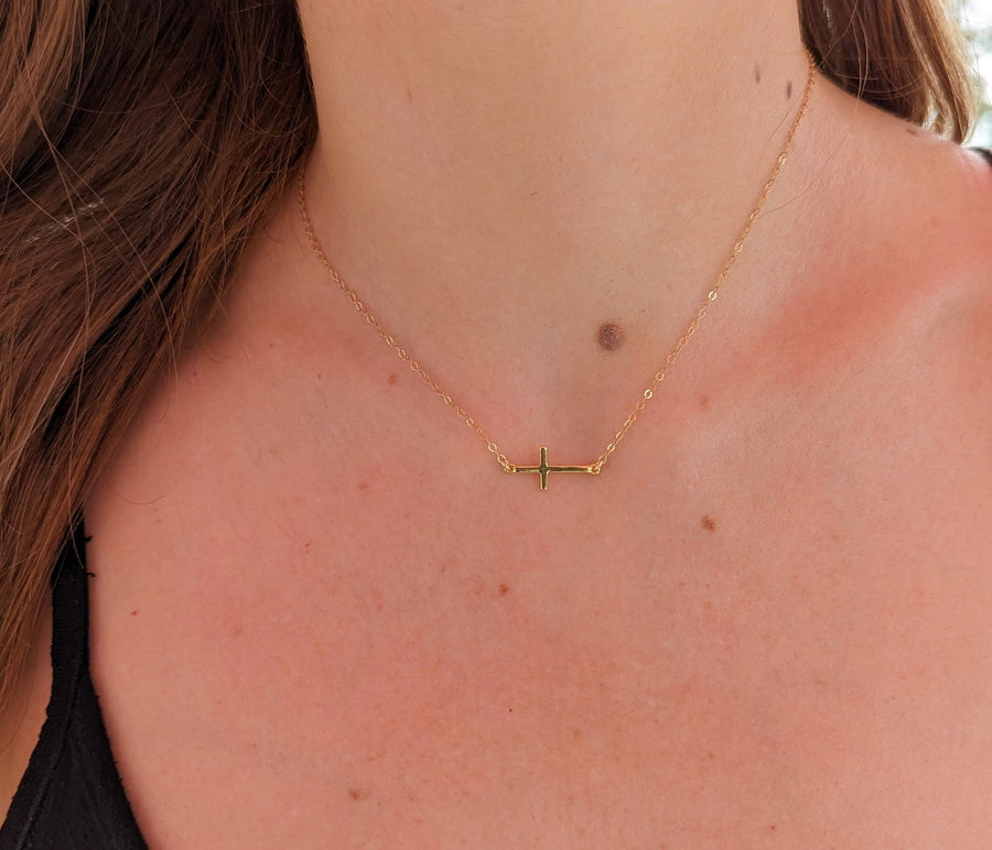 Gold sideways cross necklace