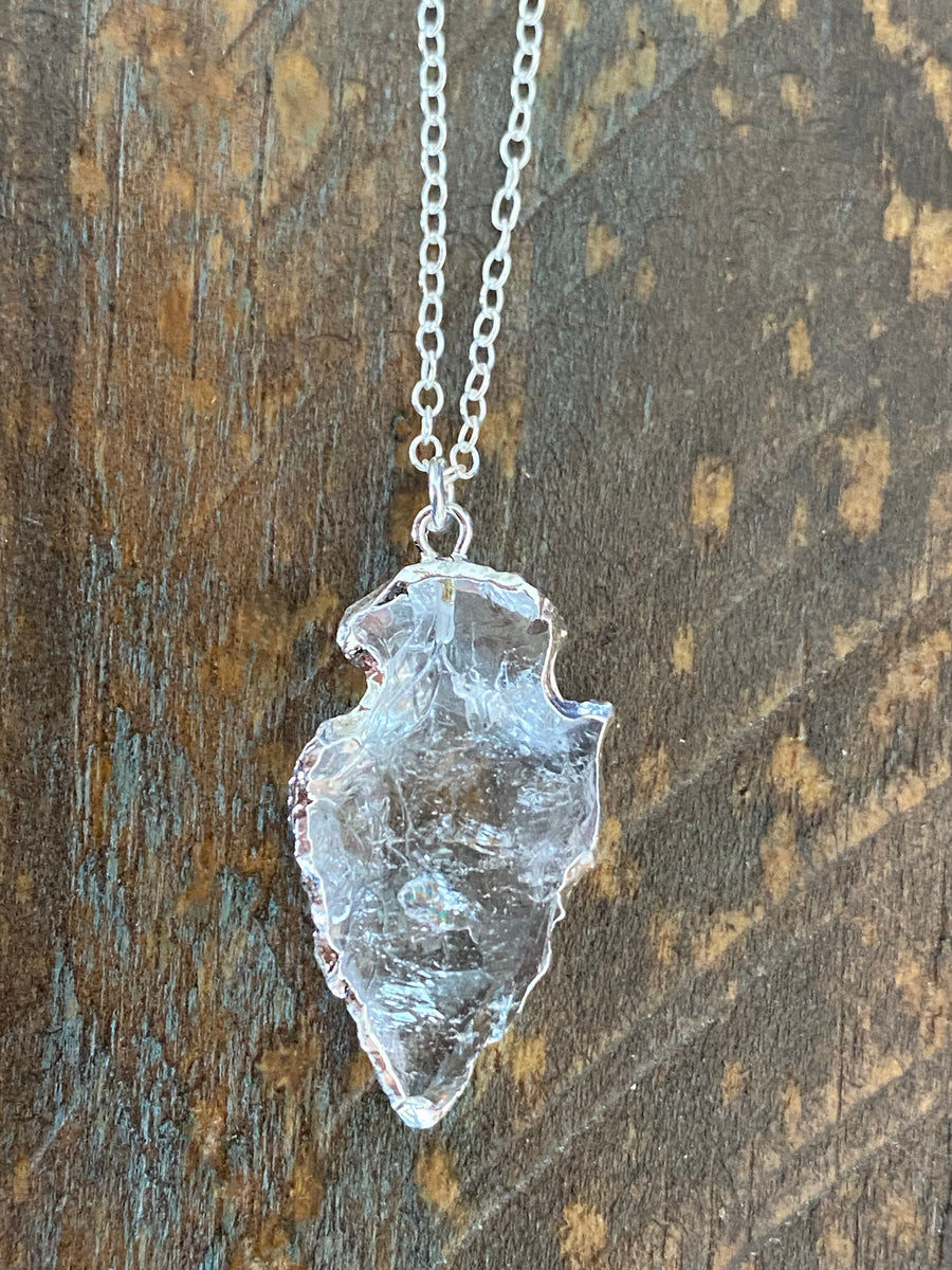 Silver clear quartz arrowhead edged in silver