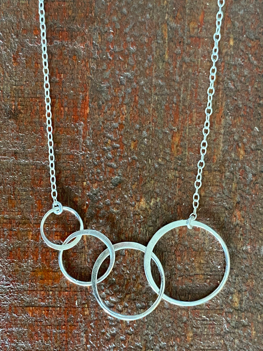 Silver infinity four circle necklace