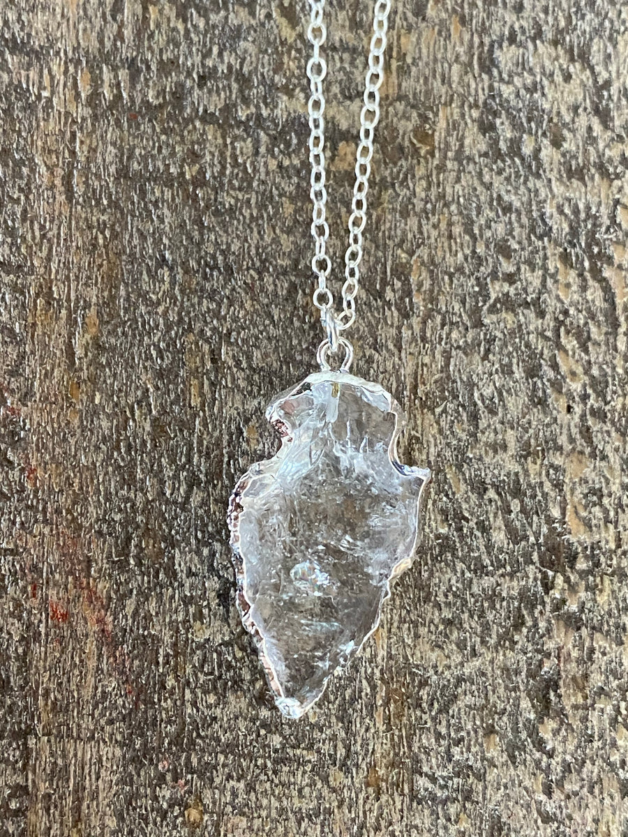 Silver clear quartz arrowhead edged in silver