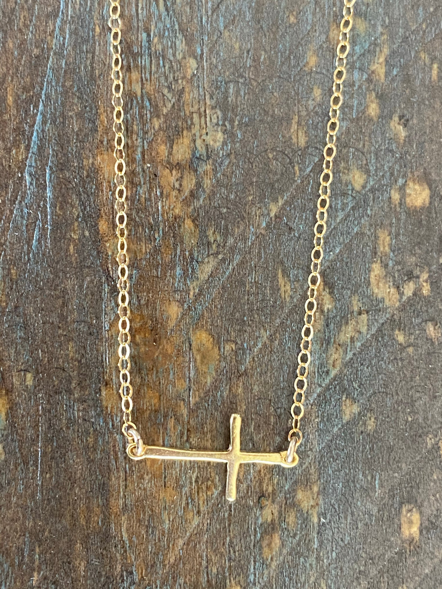 Gold sideways cross necklace